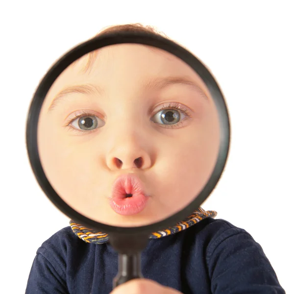 Child kiss through magnifier — Stock Photo, Image