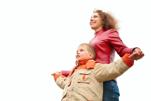 Mother and son stand outdoor and look up from below — Stock Photo, Image