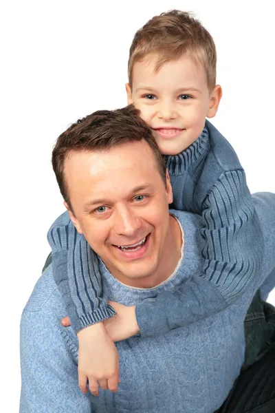 Boy embraces father behind — Stock Photo, Image