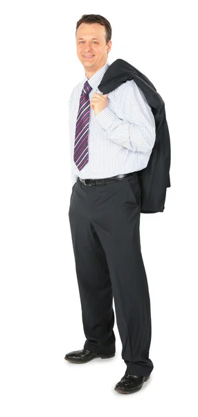 Un hombre de negocios sonriente se para — Foto de Stock
