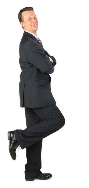 Happy businessman stands on one leg — Stock Photo, Image