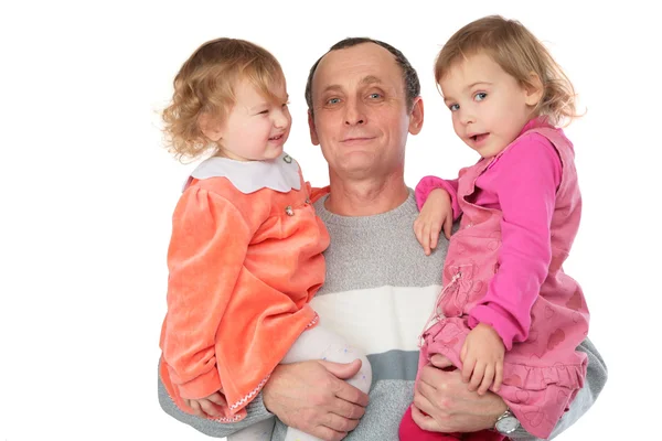 Dziadek trzymać dwie wnuczki na ręce — Zdjęcie stockowe