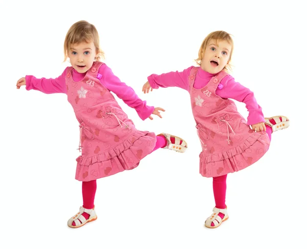 Kleines Mädchen im rosa Kleid tanzt — Stockfoto
