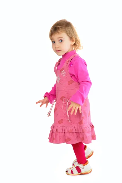Liten flicka i rosa klänning — Stockfoto
