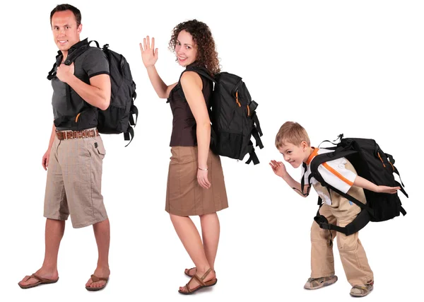 stock image Young woman with backpack has lifted hand in greeting