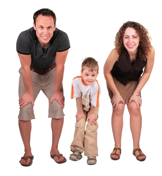 Vater, Mutter und Sohn schauen gebückt — Stockfoto