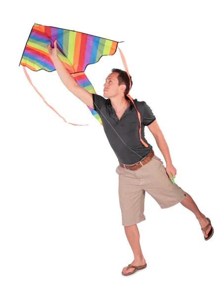 Young man starts kite — Stock Photo, Image