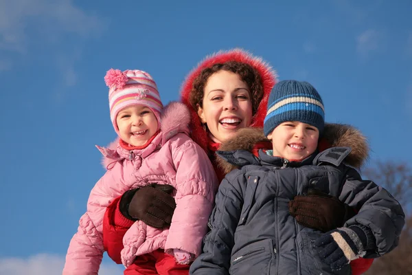 Mother and children outdoor in winter — Stock Photo, Image