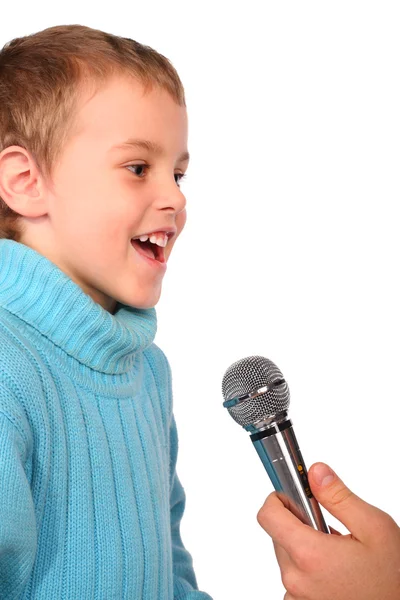 Boy sings into microphone — Stock Photo, Image