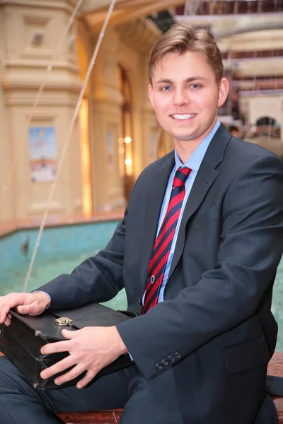 Young businessman with briefcase — Stock Photo, Image