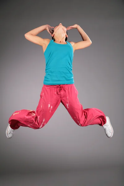 Woman in sportswear in jump — Stock Photo, Image