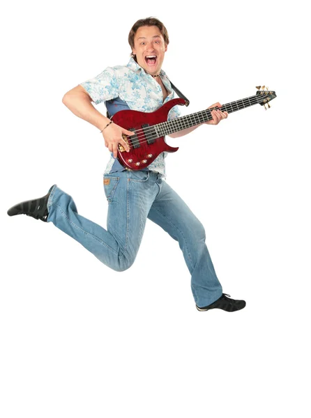 Joven con la guitarra saltando —  Fotos de Stock