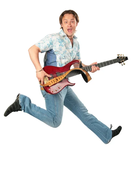 Jonge man met de gitaar springen — Stockfoto