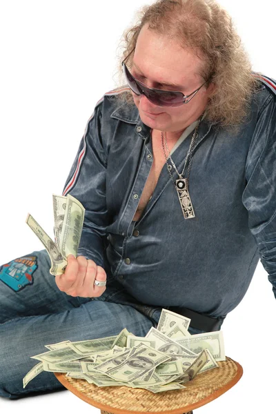 Man in sunglasses with dollars in hat — Stock Photo, Image