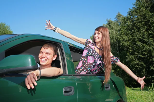 Gay and girl in car — Stock Photo, Image