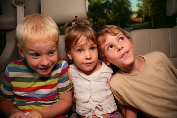 Thee children in car — Stock Photo, Image