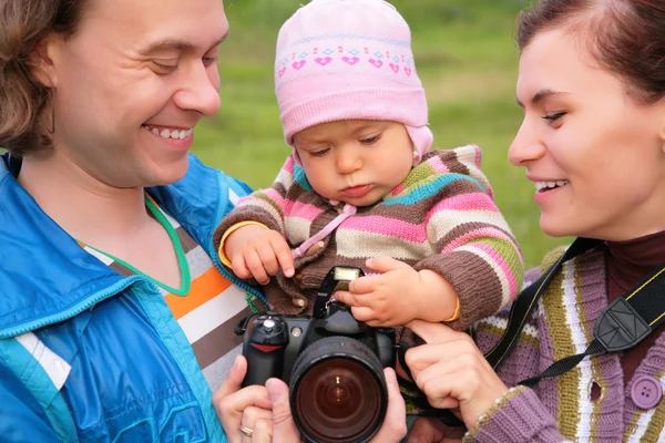 Portrait of parents with baby on nature — Stock Photo, Image