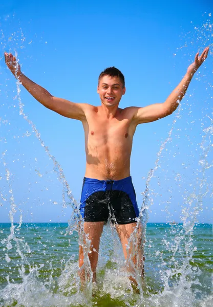 Man in sea water splash — Stock Photo, Image