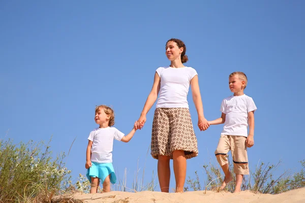 Mother and children on sand — Stock Photo, Image
