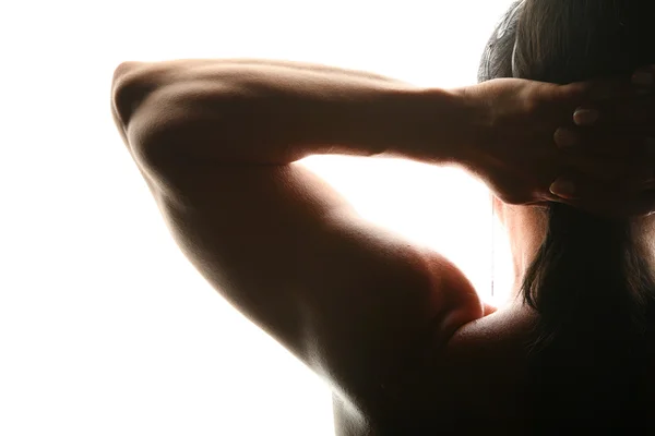 Silhouette di donna bodybuilder da dietro — Foto Stock