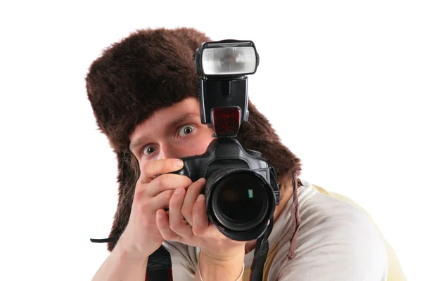 Photographer in a cap with ear-flaps — Stock Photo, Image