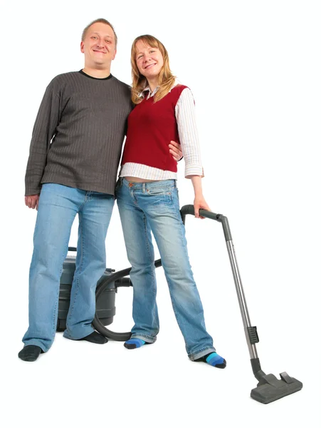 Adam kadına elektrikli süpürge ile kucaklar — Stok fotoğraf