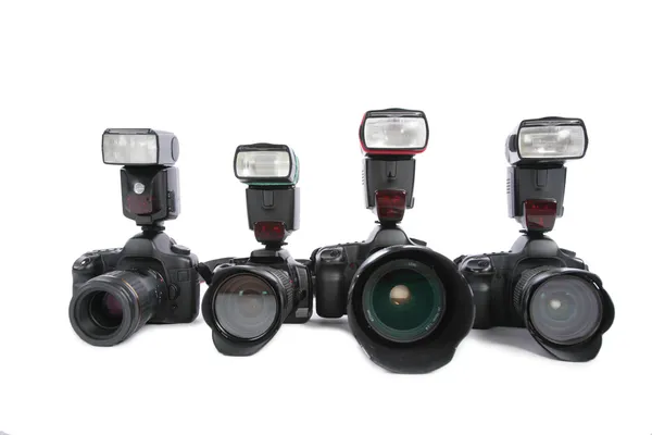 Câmeras com flashes no fundo branco — Fotografia de Stock