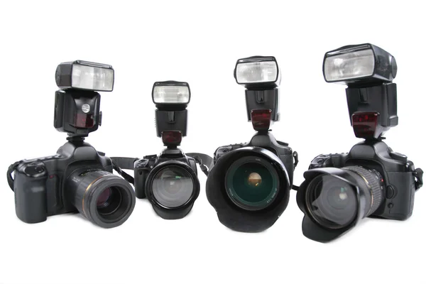 Câmeras com flashes no fundo branco — Fotografia de Stock