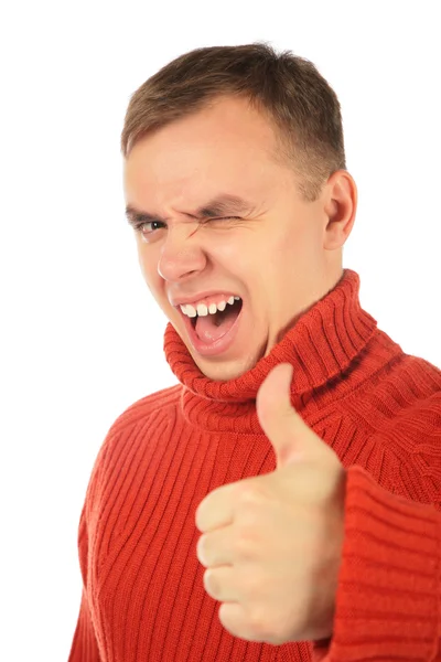 Молодой человек в красном свитере делает жест за пальцем — стоковое фото