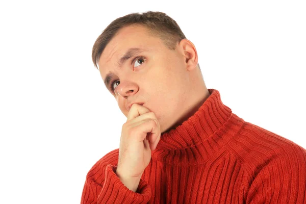 Συλλογισμένος νεαρός άνδρας στο κόκκινο πουλόβερ — Φωτογραφία Αρχείου