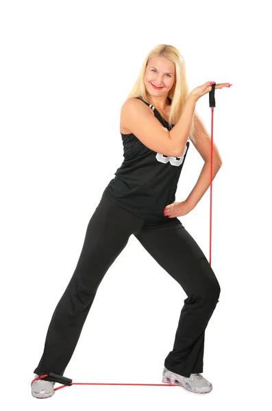 Sport blond makes exercise with rope — Stock Photo, Image