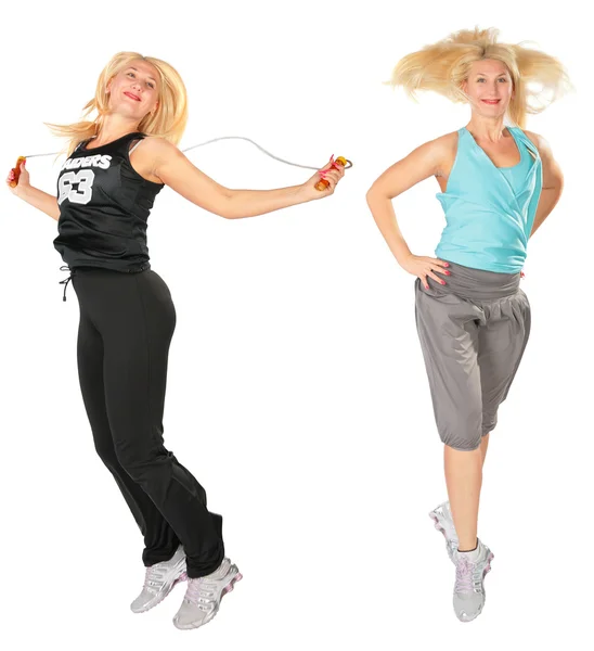 Sport blond makes exercise with jumping rope — Stock Photo, Image