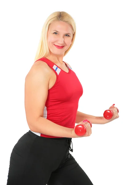 Sport blond makes exercise with dumbbells — Stock Photo, Image