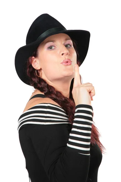 Portrait of beauty woman in black hat makes gesture by finger — Stock Photo, Image