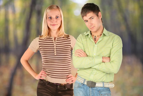 Couple on autumnal background — Stock Photo, Image