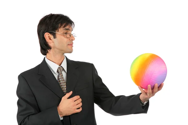Businessman with multicolor ball — Stock Photo, Image
