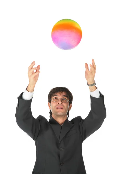 Üzletember fogások többszínű labda — Stock Fotó