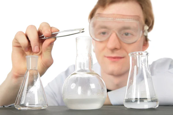 Chemist and three flasks — Stock Photo, Image