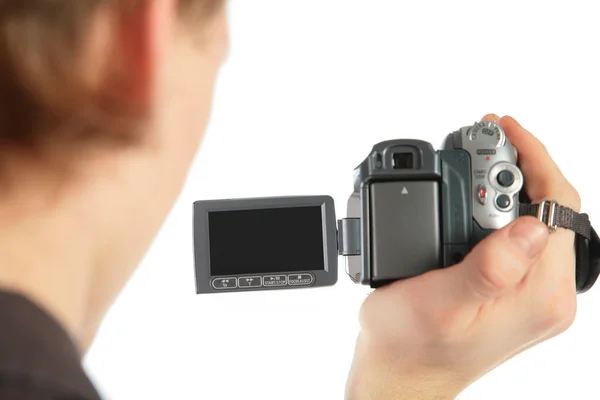 Man with camcorder in hand from back — Stock Photo, Image