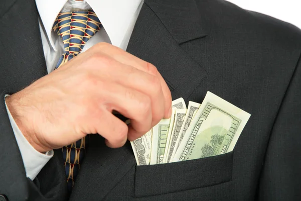 Dollars in pocket of coat and hand — Stock Photo, Image