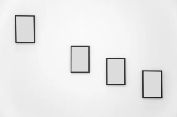 Four frames on white wall — Stock Photo, Image