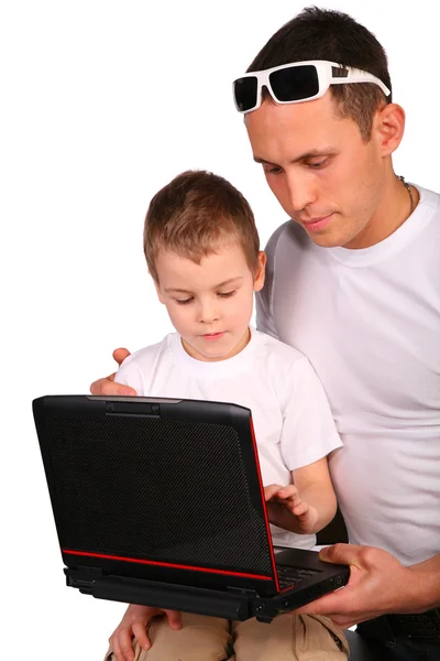 Father and son working with notebook Royalty Free Stock Photos