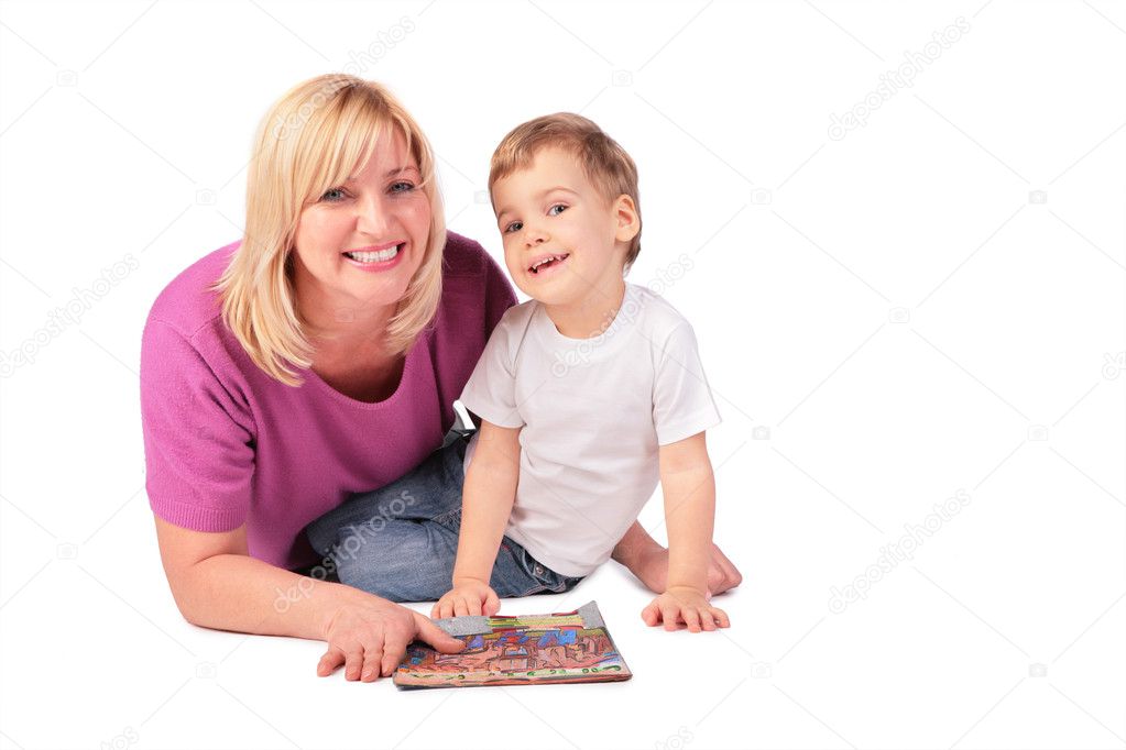 Middleaged woman in pink shirt with child and magazine