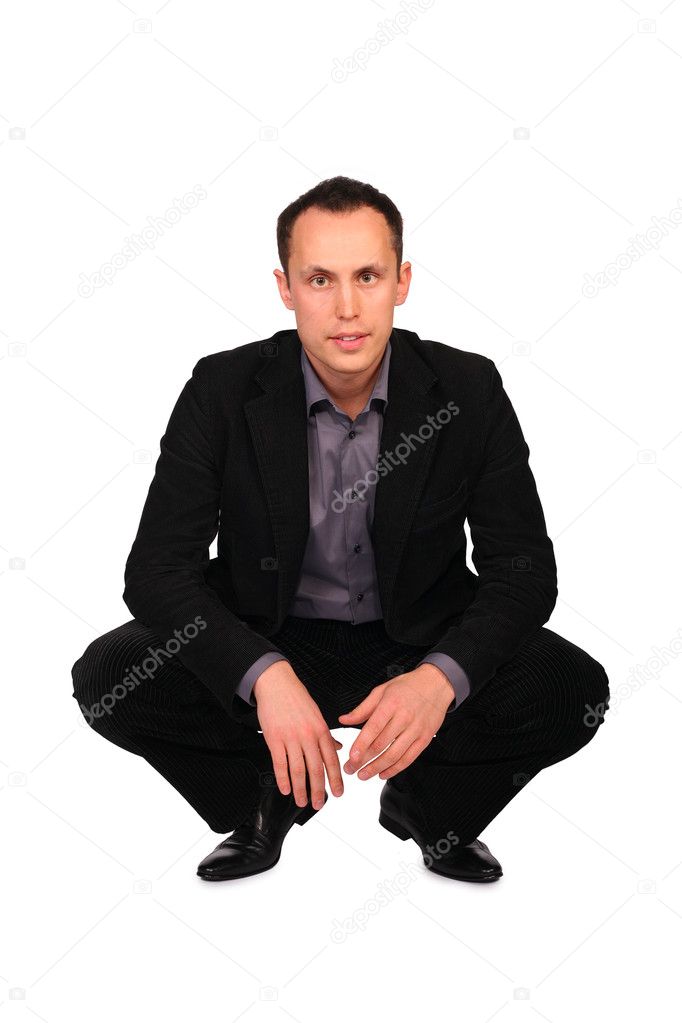Young businessman sits