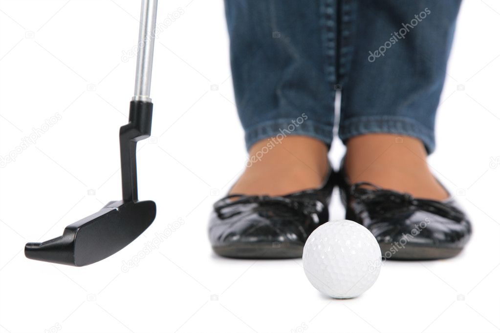 Feet, stick and ball for golf