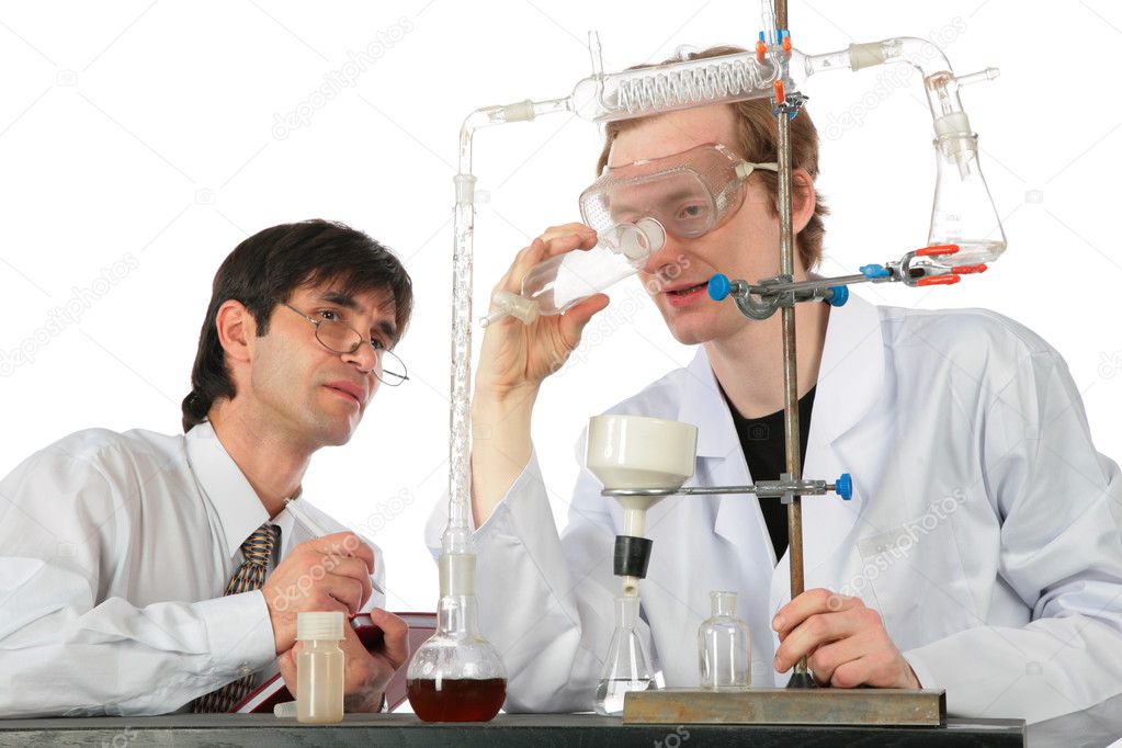 Two chemists with chemical equipment