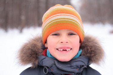 Smiling boy without foreteeth clipart