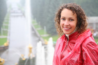 Young woman on large cascade in Peterhof clipart