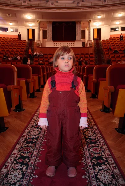 Little girl in theatrical hall — Stock Photo, Image