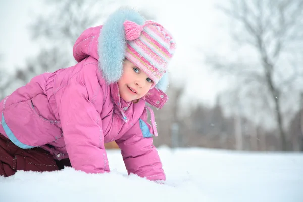 Little girl on snow — Stock Photo, Image